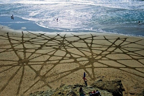 Andres Amador leads massive sand art project at Swami's Beach