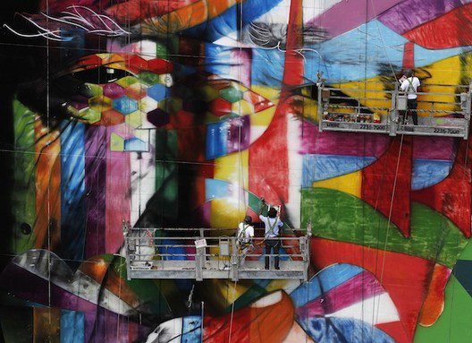 brazilian graffiti artist kobra puts the final touches to his piece of art in tribute to brazilian architect niemeyer next to his assistants at the financial center in sao paulo 2