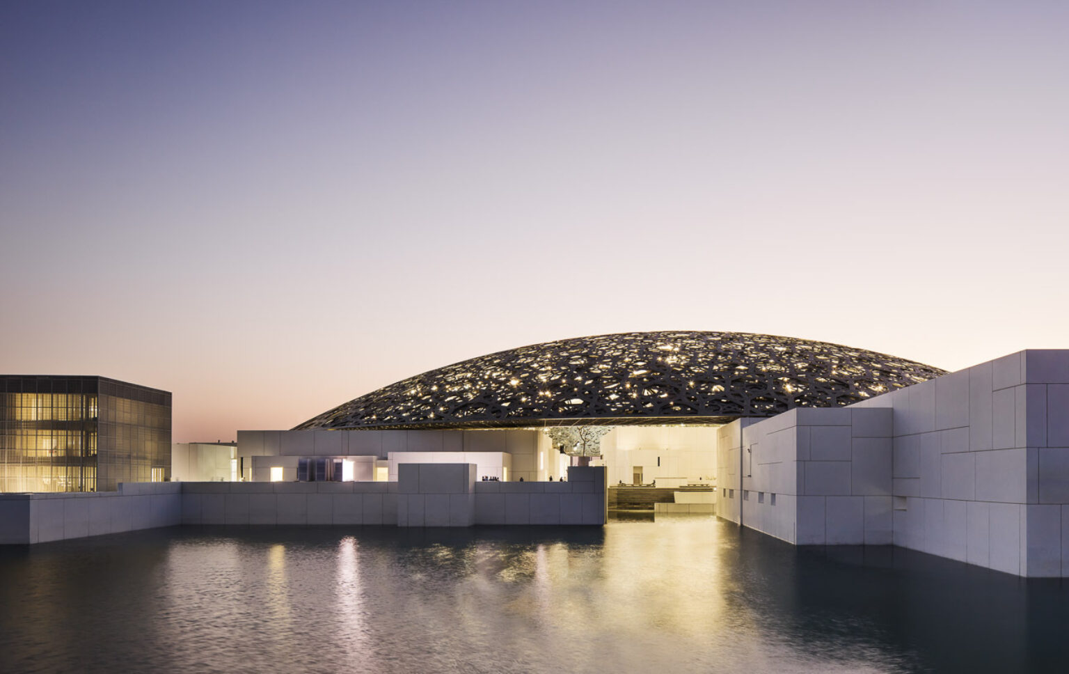 Detailed view of the Louvre Abu Dhabi dome showcasing its intricate star-patterned lattice