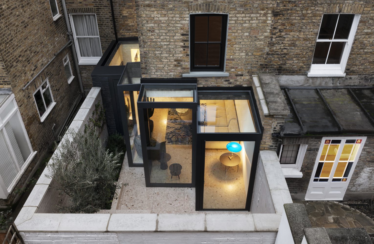 Arch2O glass extension makes an old victorian house 10x better