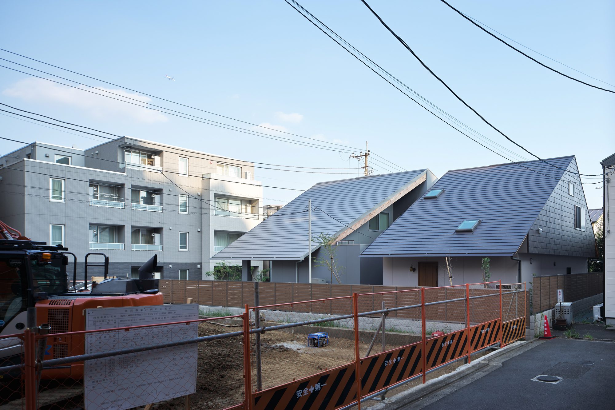 Two Large Roofs Leaning Together