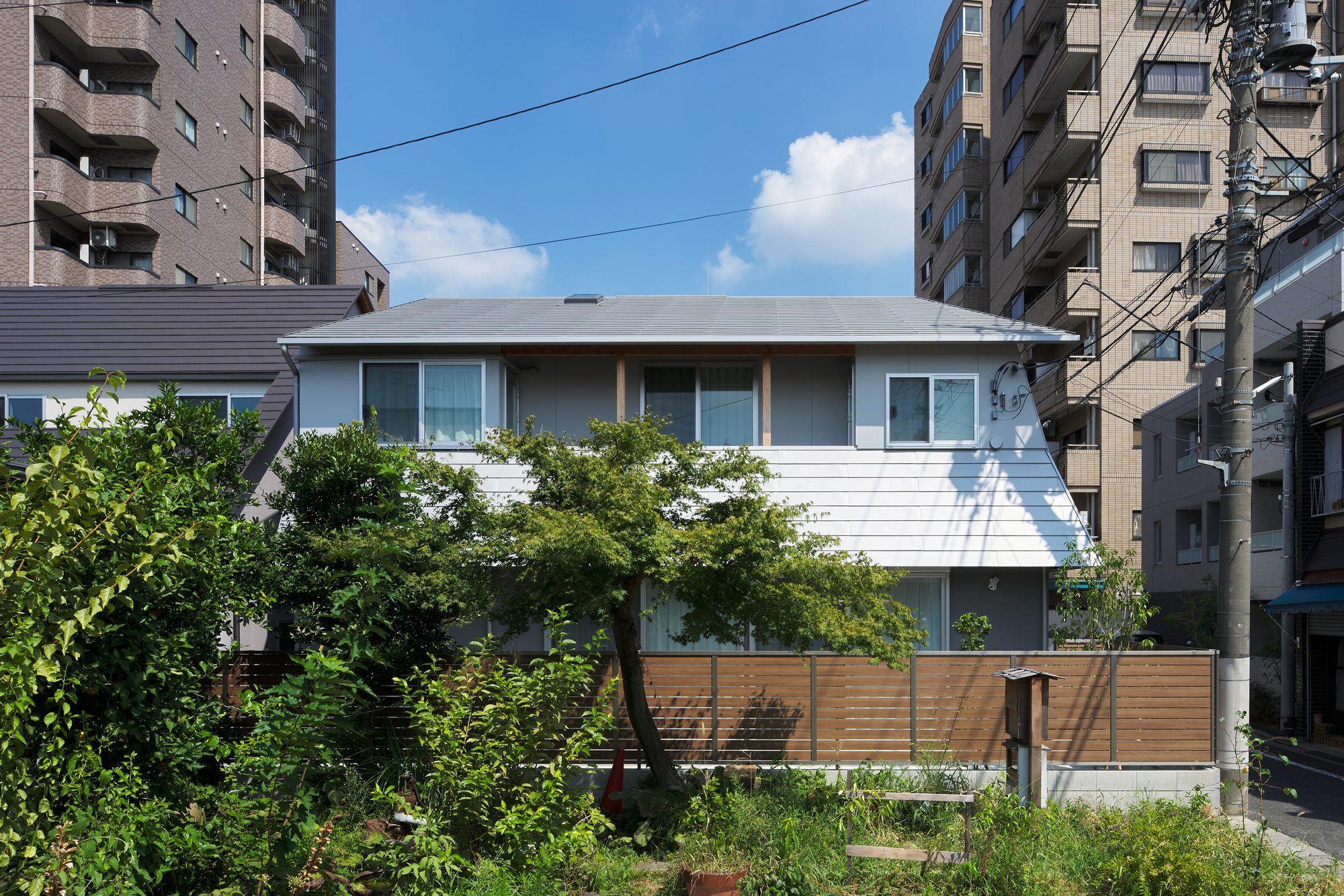 Two Large Roofs Leaning Together