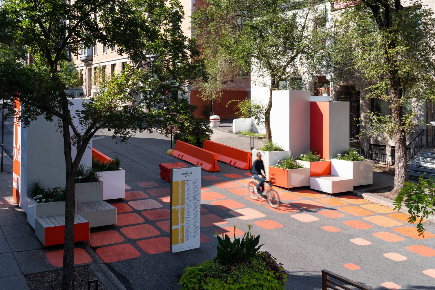 Colorful tactical urbanism installation transforming a public street for pedestrians