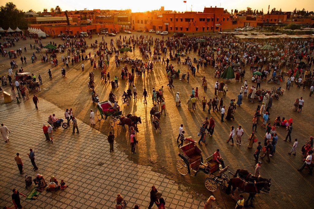 Crowds fill the Jemaa el-Fna square in Marrakech at dusk