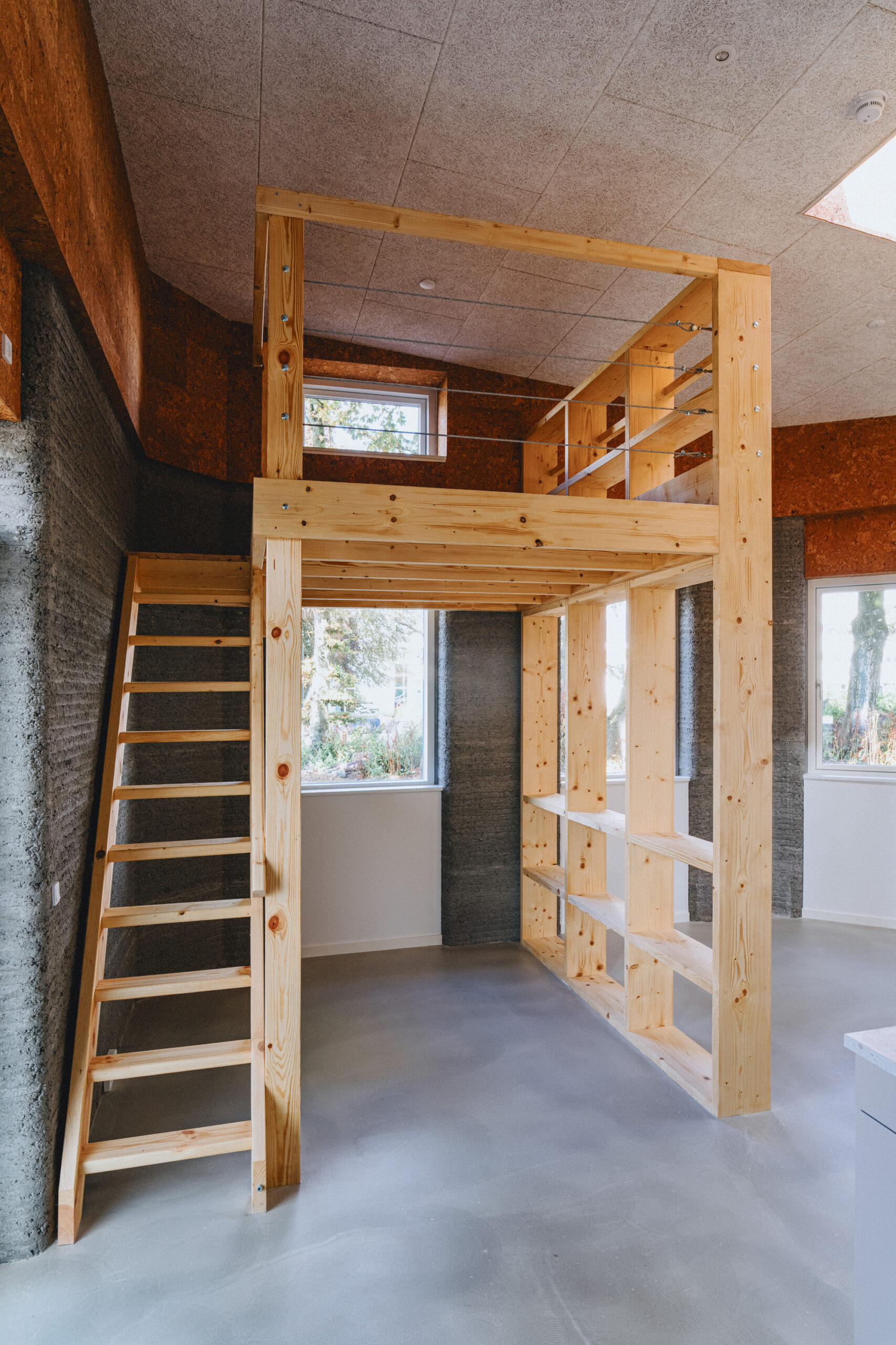 On-site concrete 3D printer forming curved wall layers for student housing