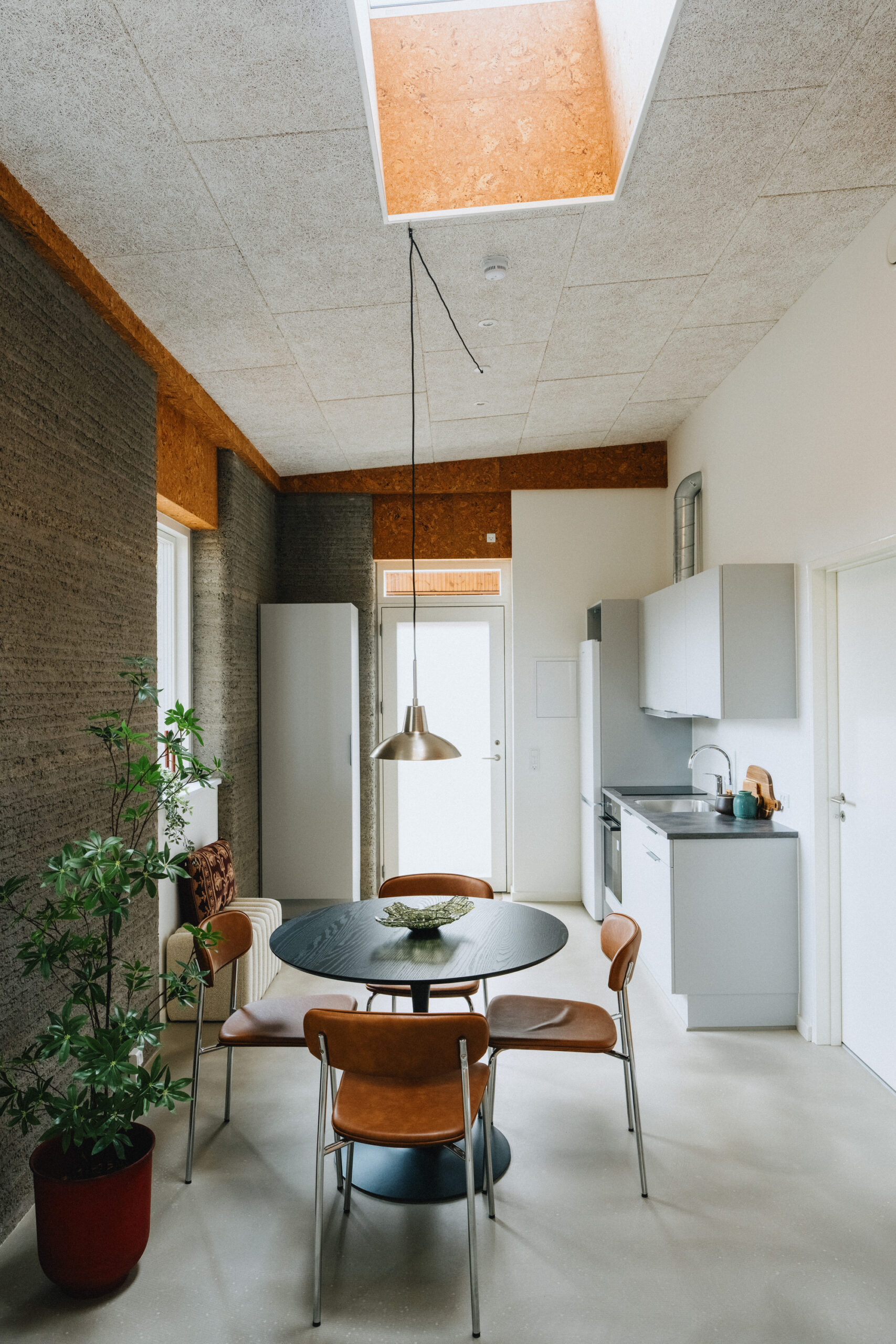 Layered 3D-printed concrete wall texture on a completed student apartment