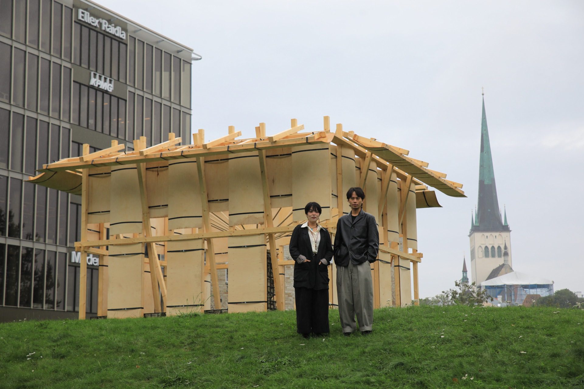 Resonance pavilion built from rebar, rope, limestone, and plywood around a stone core