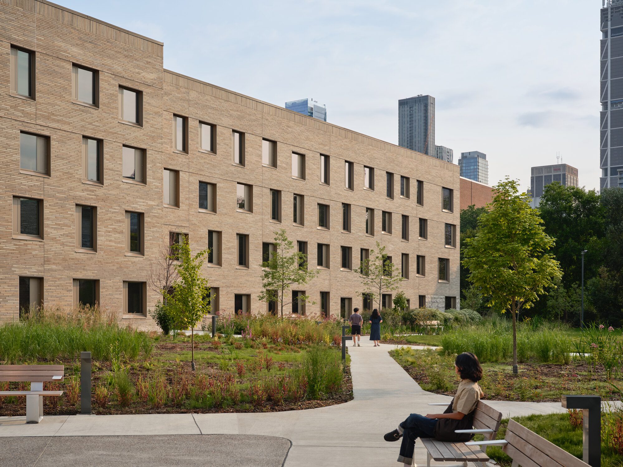 Evening exterior view of the Lawson Centre framing a new campus courtyard