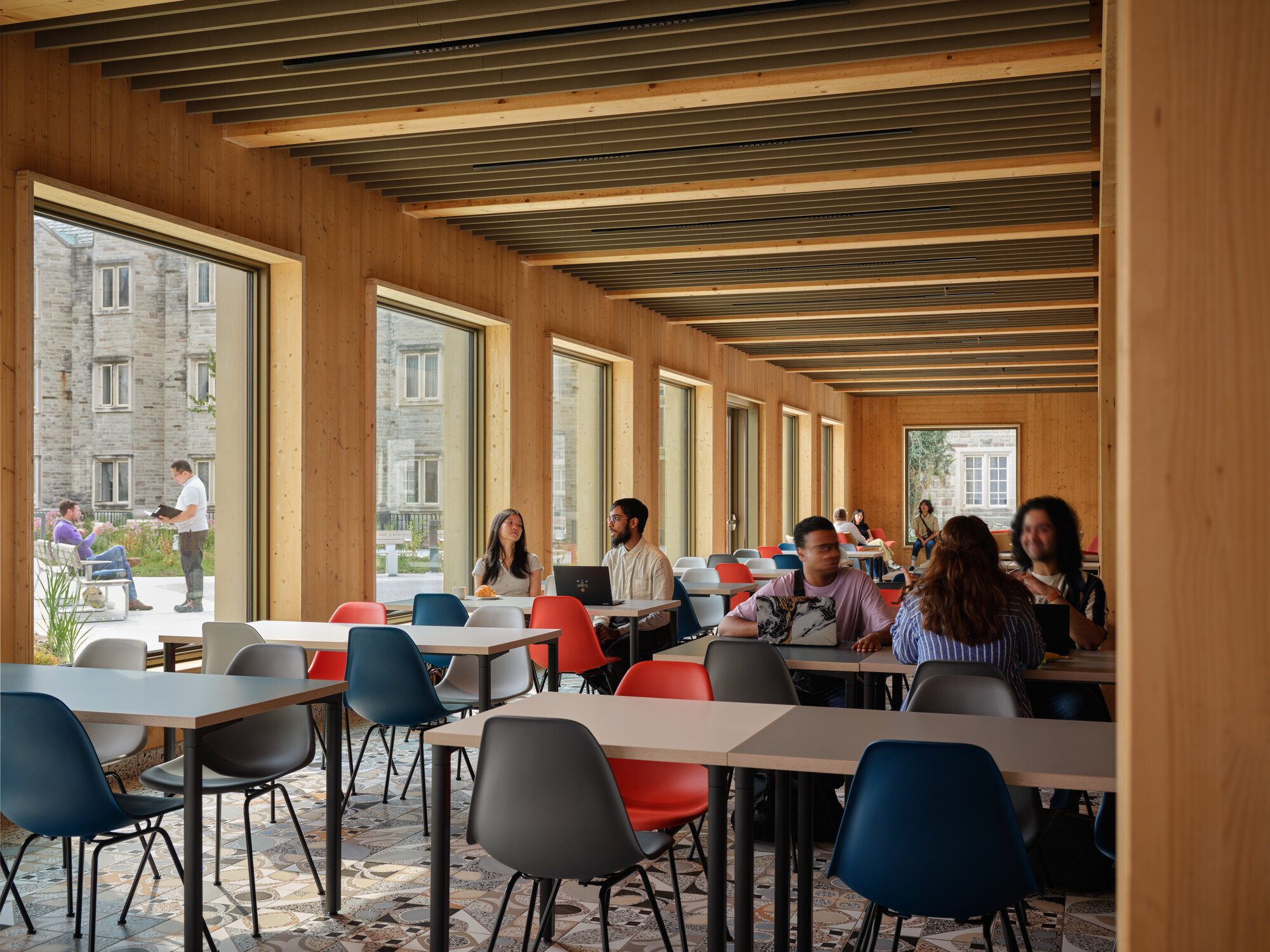 Rainwater collection feature integrated into the building's landscape edge