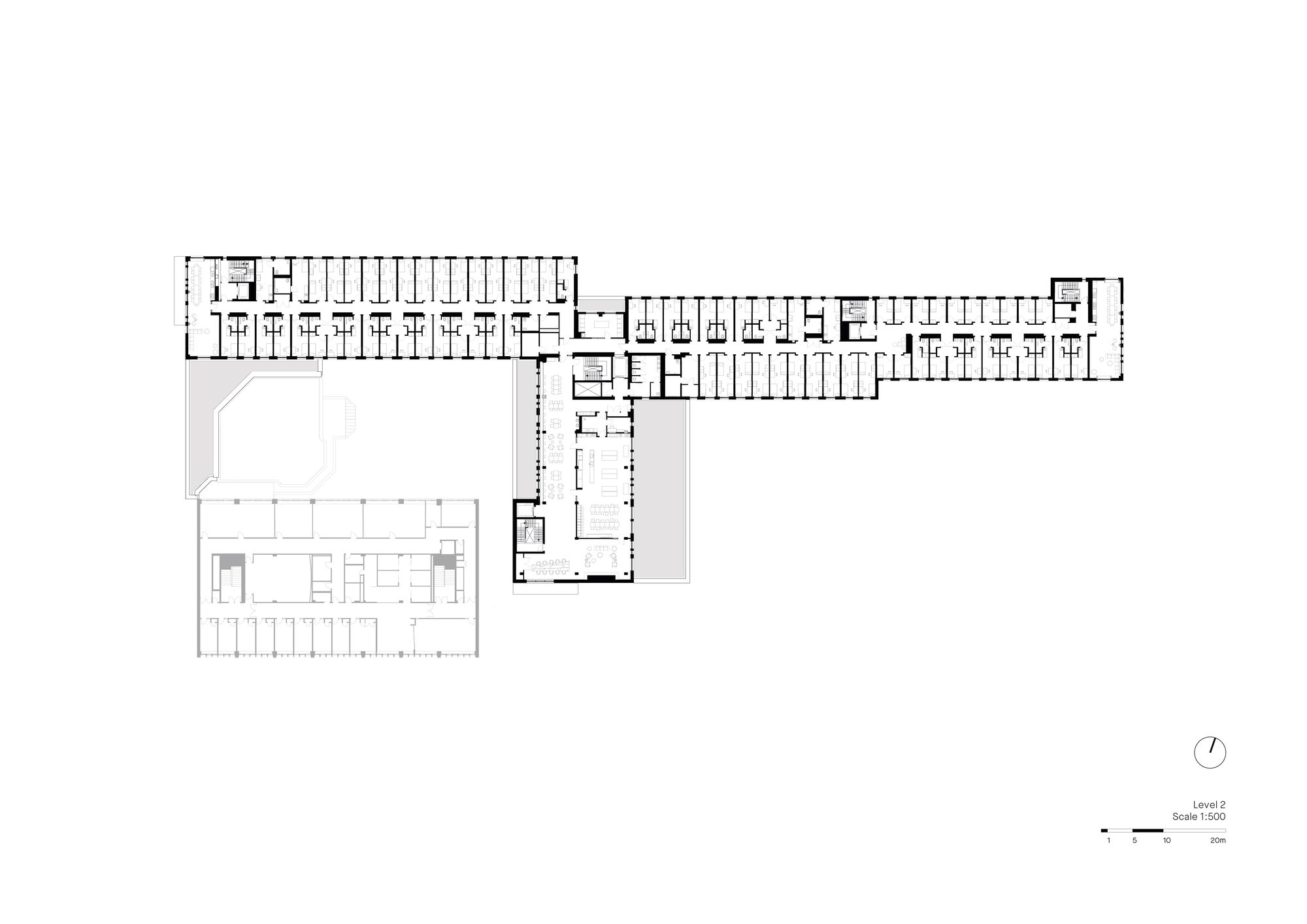 Double dorm room with warm timber walls and a shifted facade window