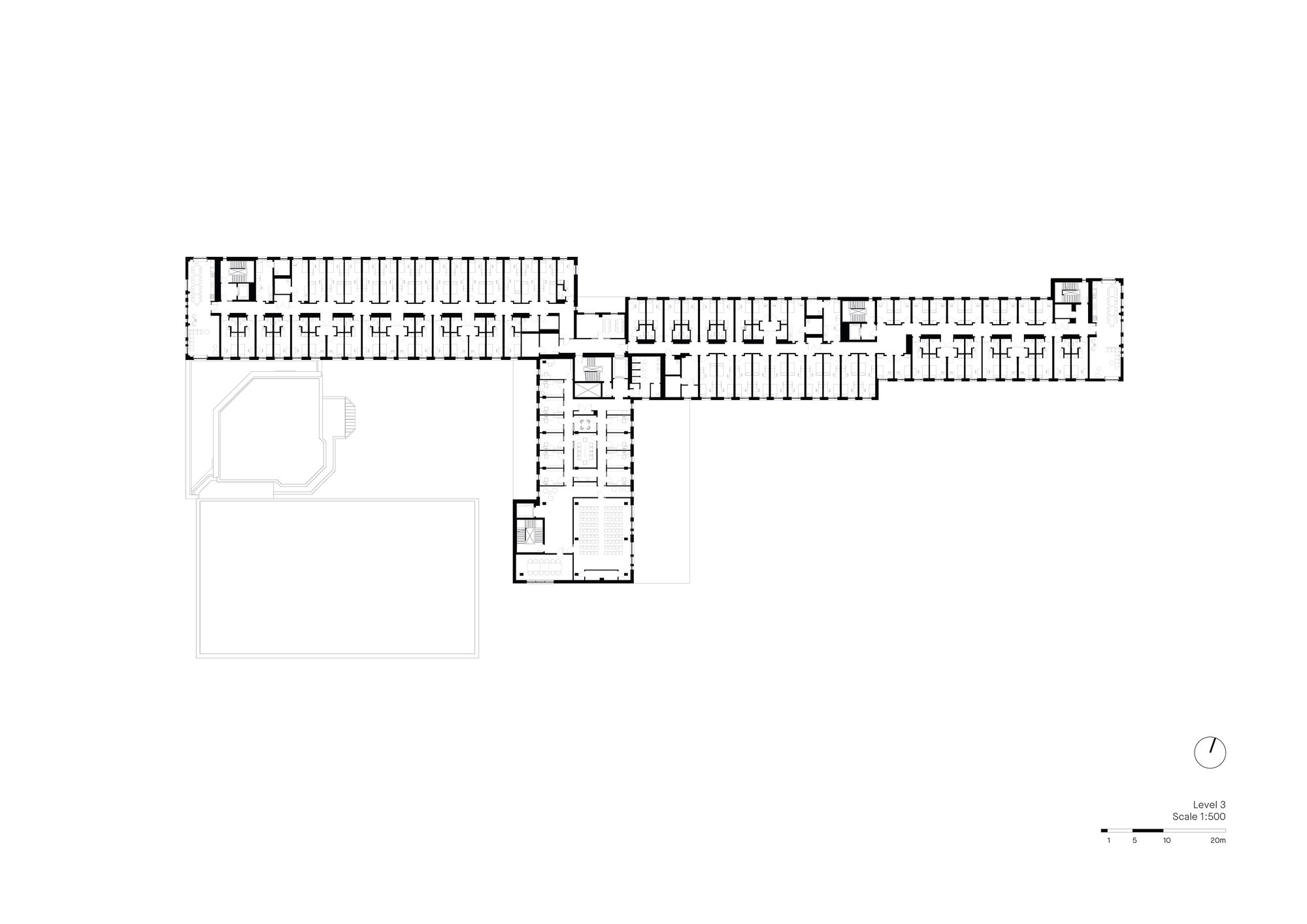 Long section of the walkable T-volume framing the existing campus
