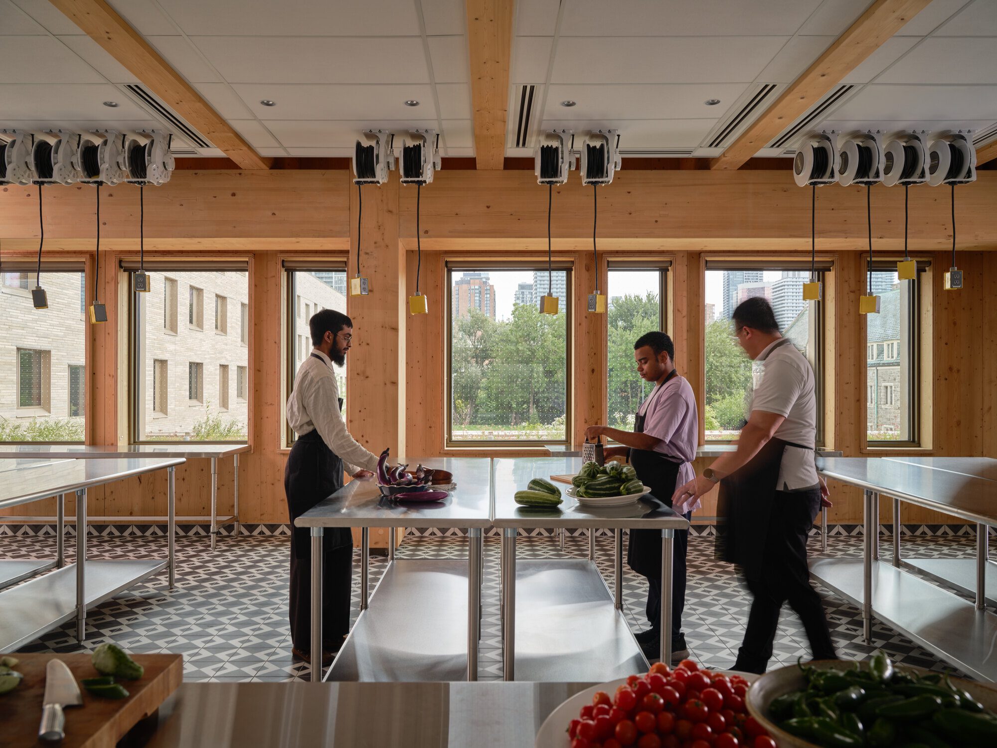 Aerial view of the T-shaped roof with photovoltaic panels and rooftop urban farm