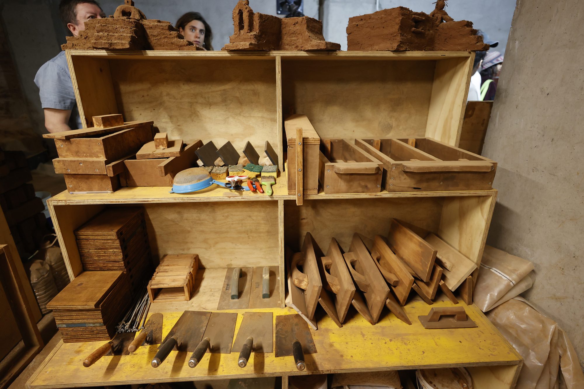 Students learning carpentry and rammed-earth techniques at a Valparaiso heritage trades course