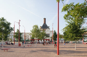 Mendel Square by CHYBÍK + KRIŠTOF, a public space with surrounding buildings and paving