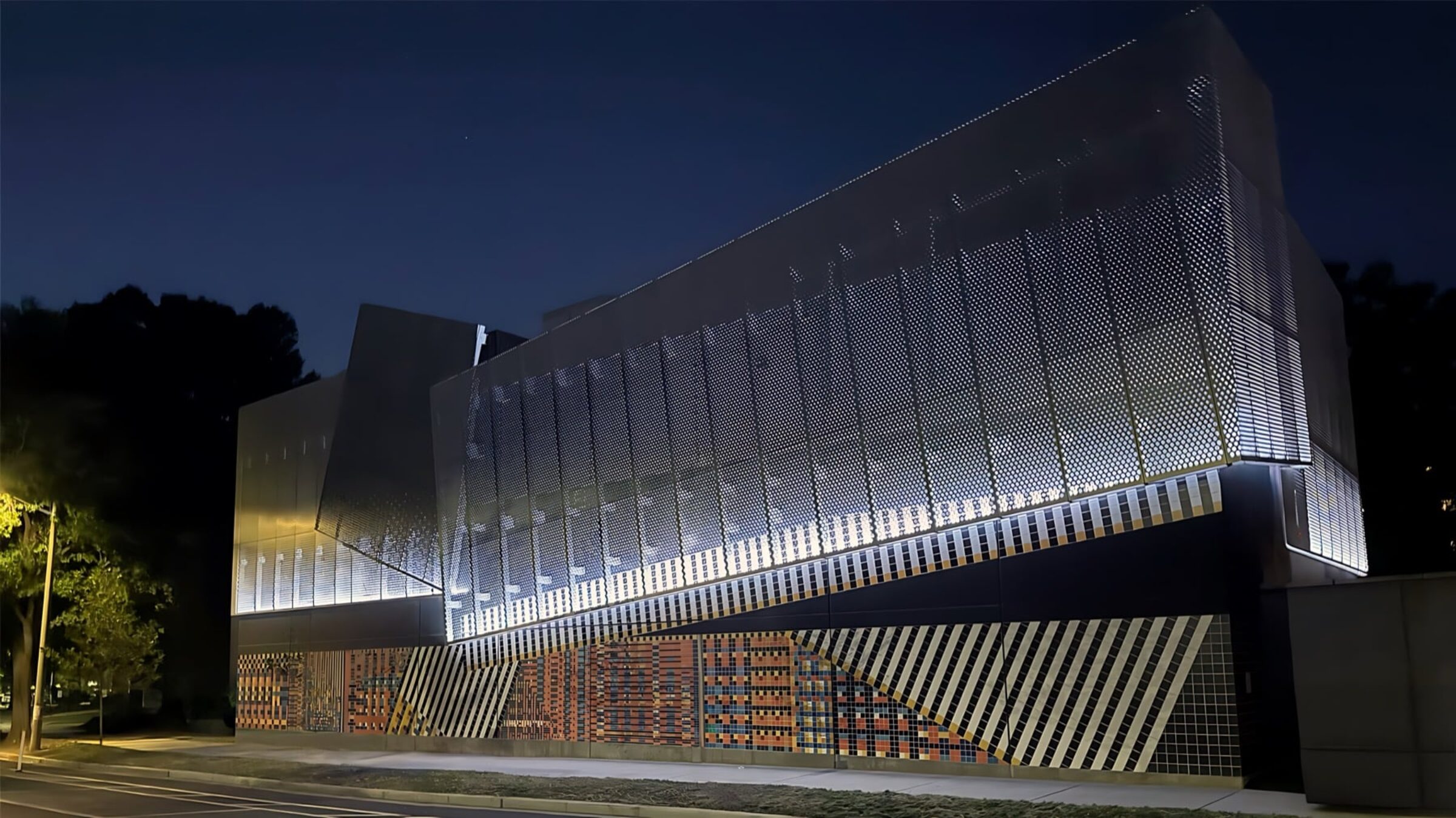 Substation facade at night lit with changing RGB LED patterns