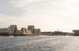 KAI Water Culture House with brick towers above a glazed base on Paper Island, Copenhagen