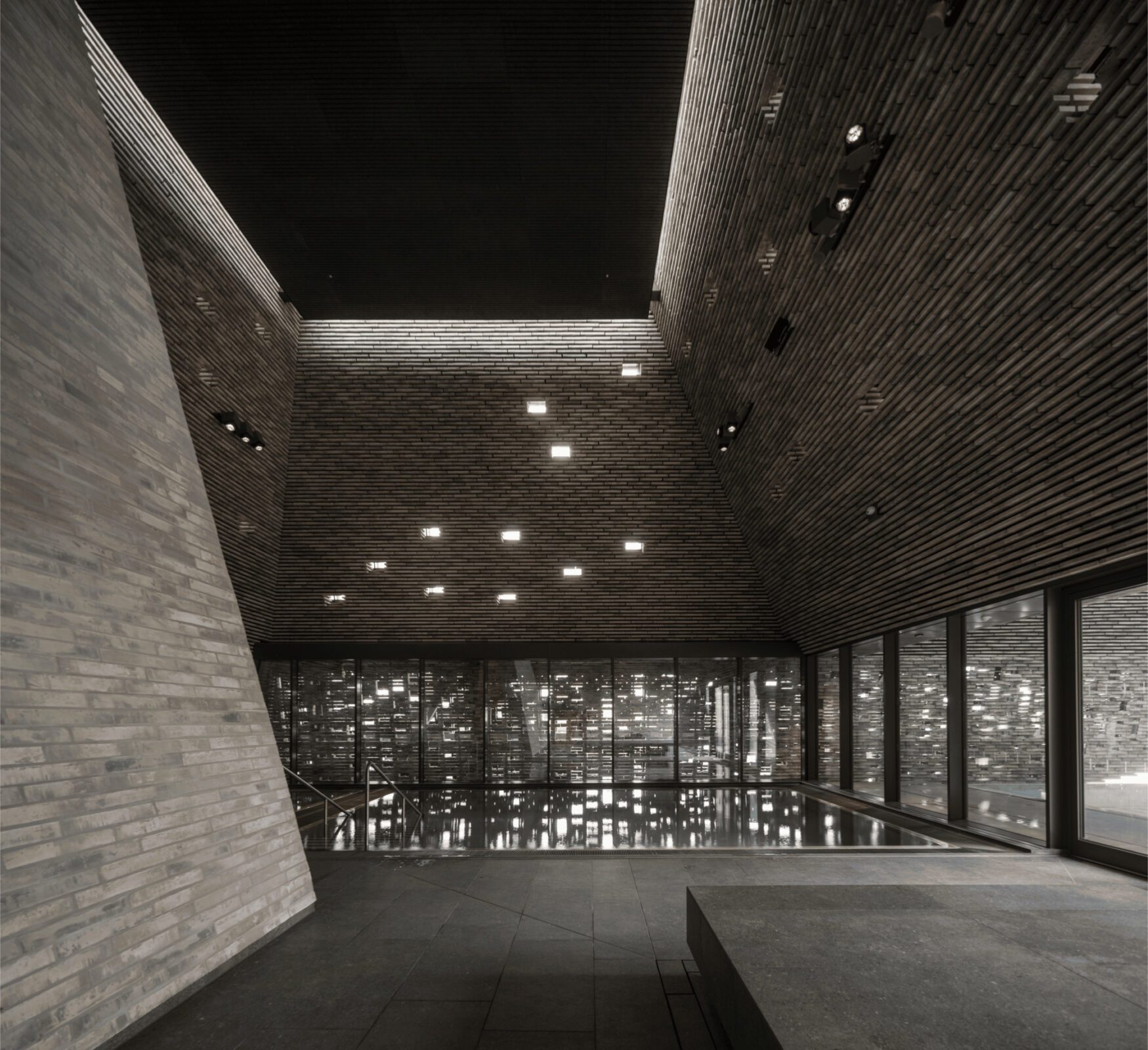 Pool and wellness interior of the Water Culture House lit by natural light