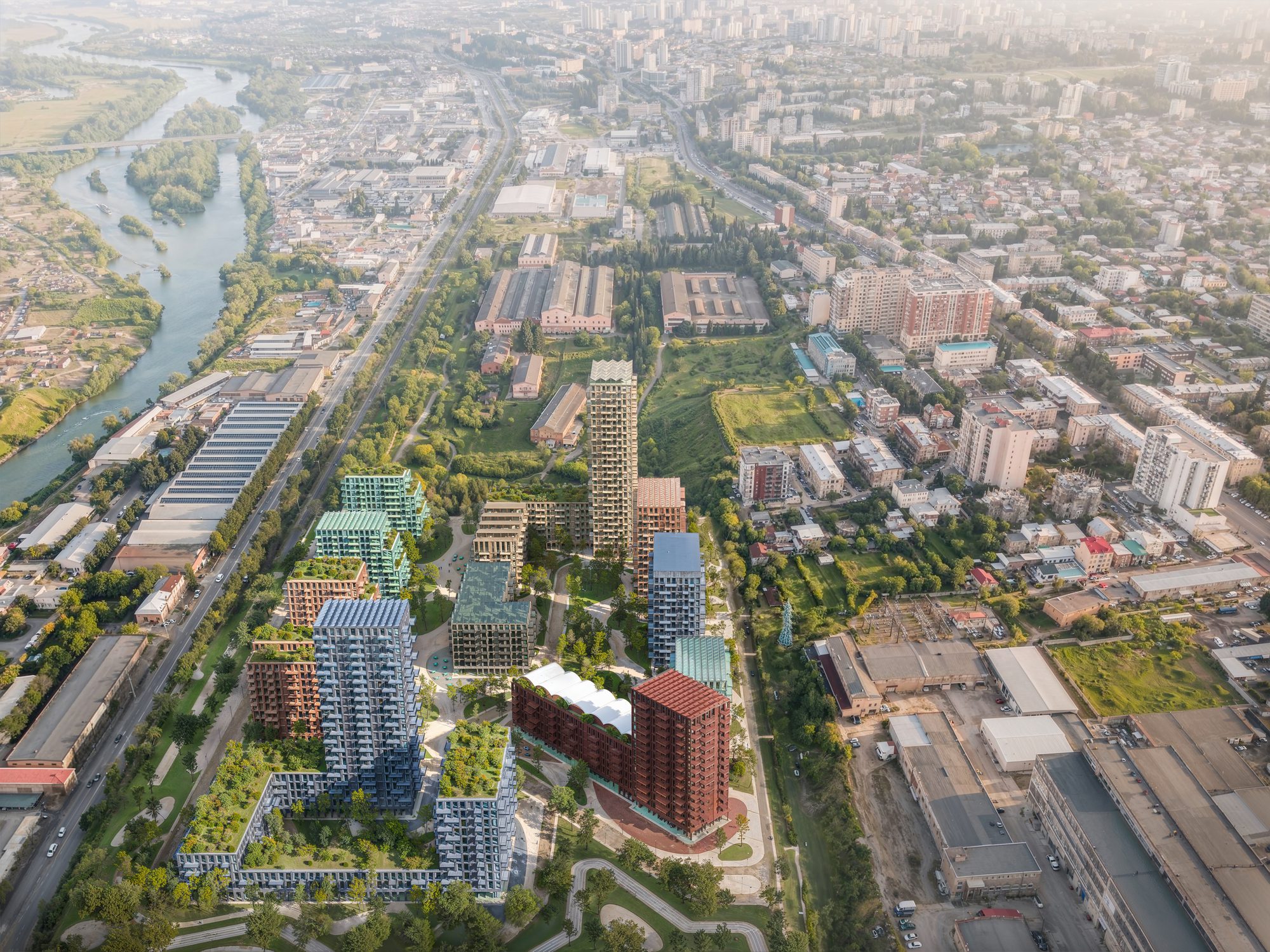 Aerial view of the Loco Park masterplan with brick buildings and green spaces in Tbilisi