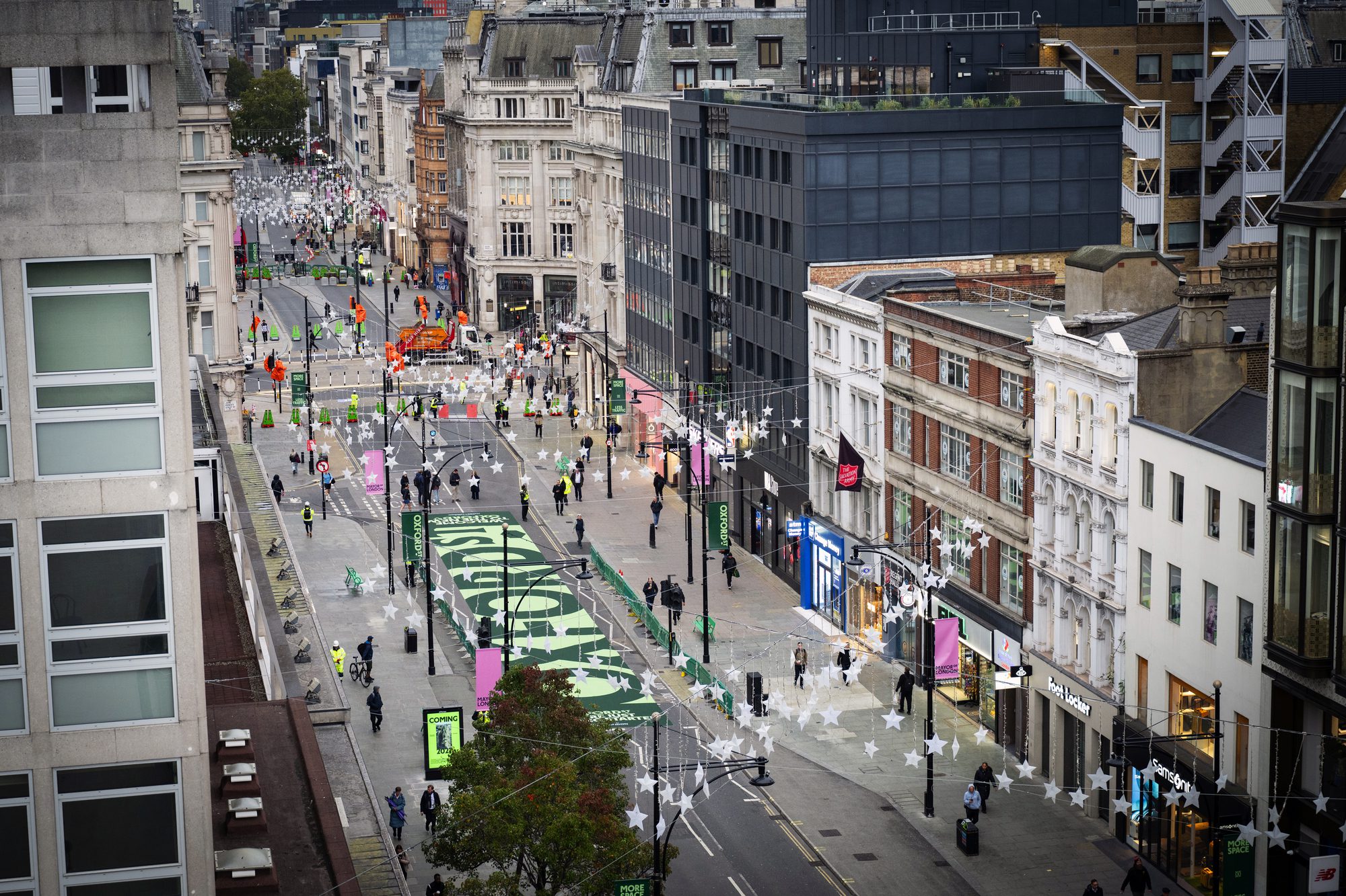 Pedestrians walking along the newly traffic-free first phase of Oxford Street in London