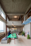 Brutalist Duplex Apartment in de Riverside Tower | Studio Okami Architects